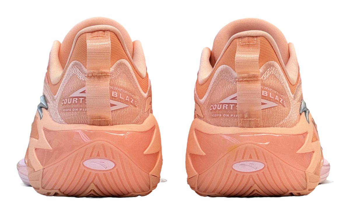 Light pink and orange basketball shoe heels with COURT branding on the collar