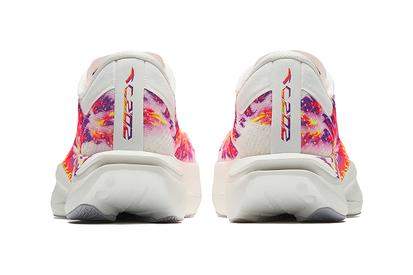 Rear view of white running shoes with multicolor print and molded heel collar