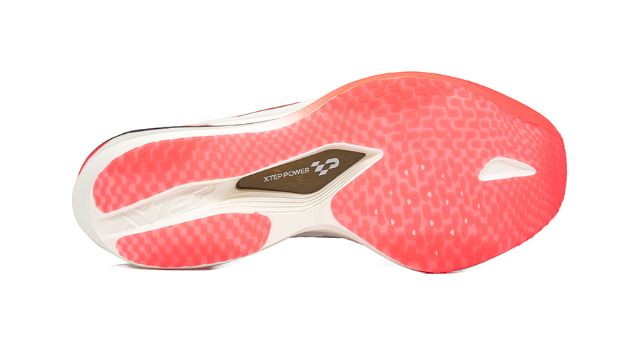 White and red marathon racing shoe outsole with traction tread and XTEP POWER label