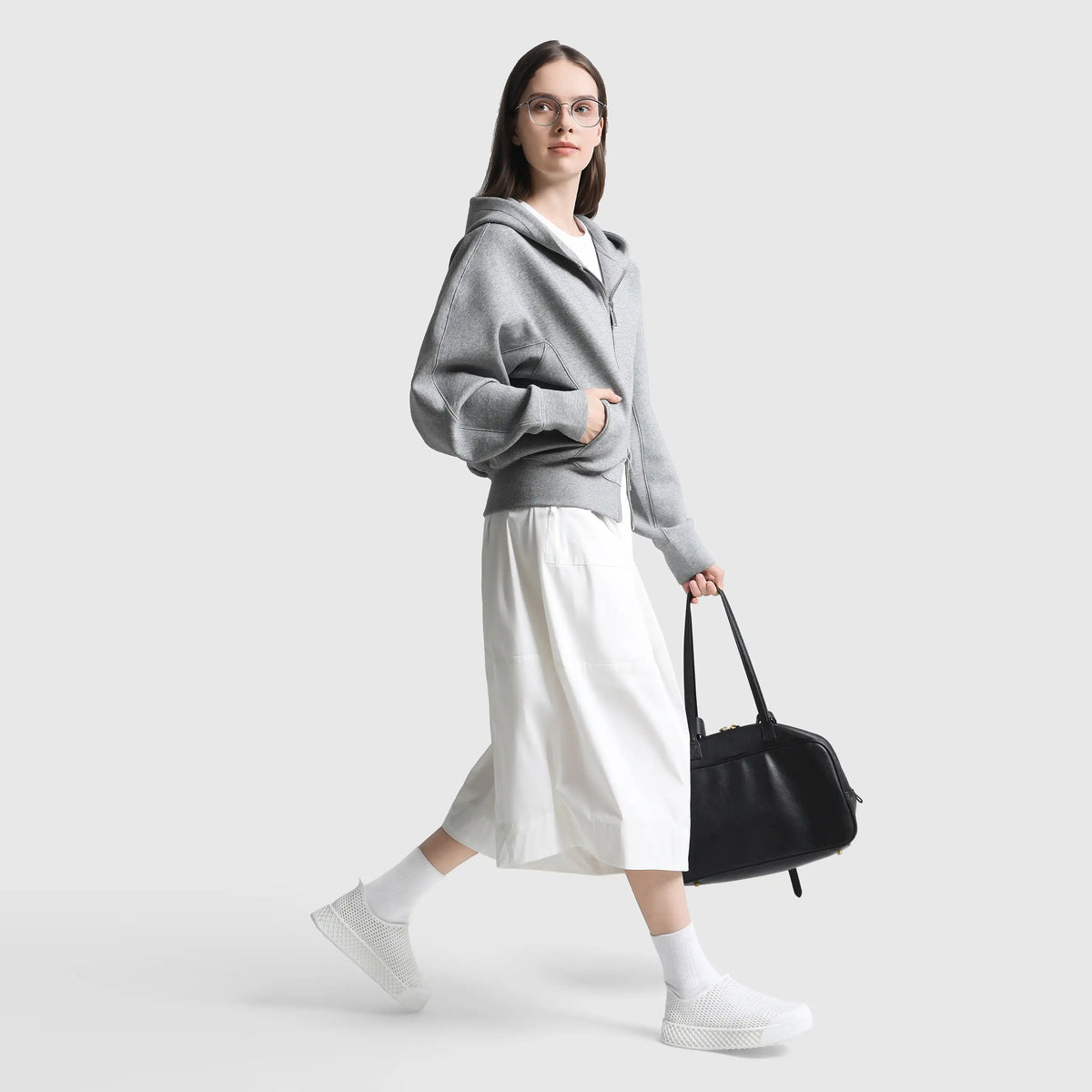 White 3D-printed casual sneakers with white socks and mesh slip-on design