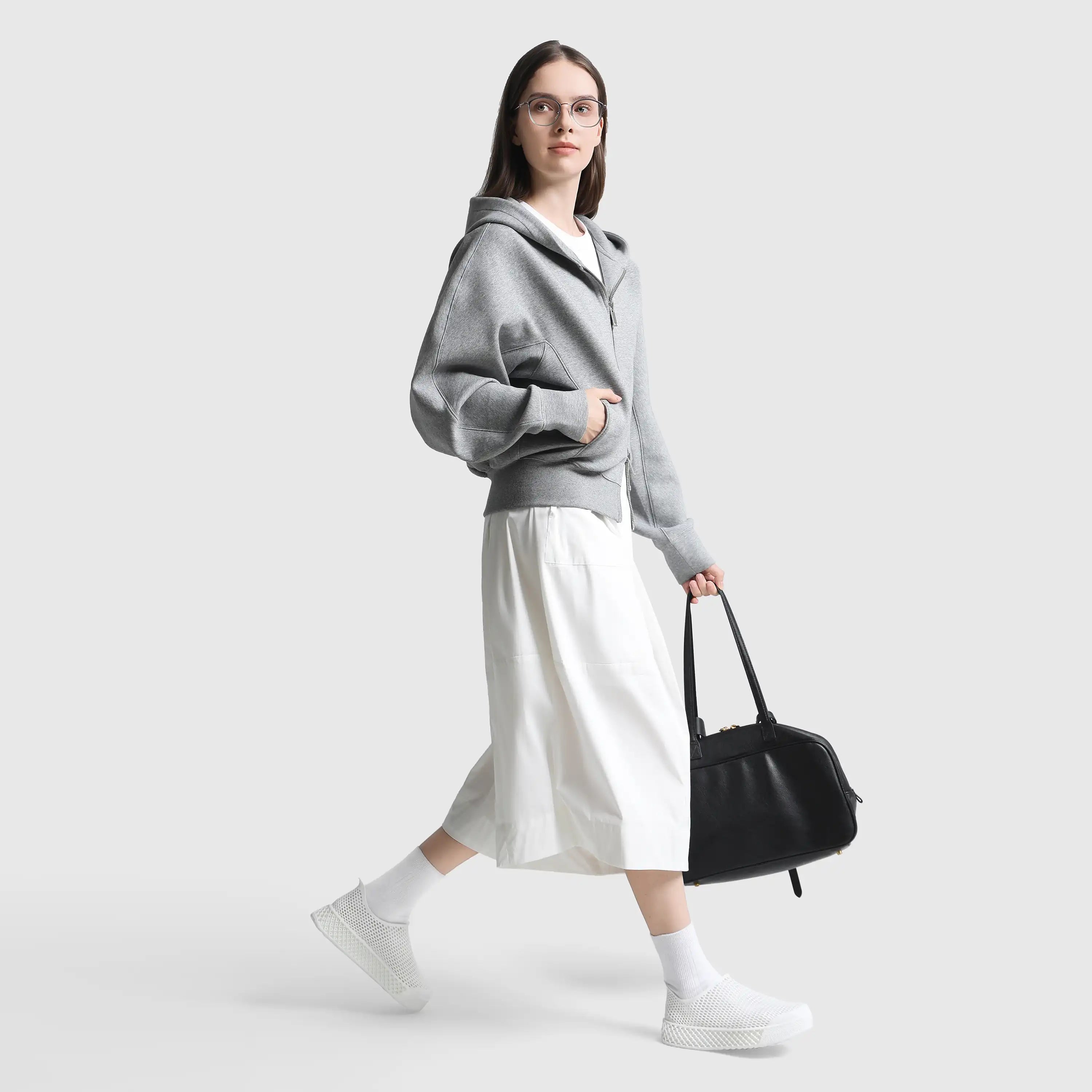 White 3D-printed casual sneakers with white socks and mesh slip-on design