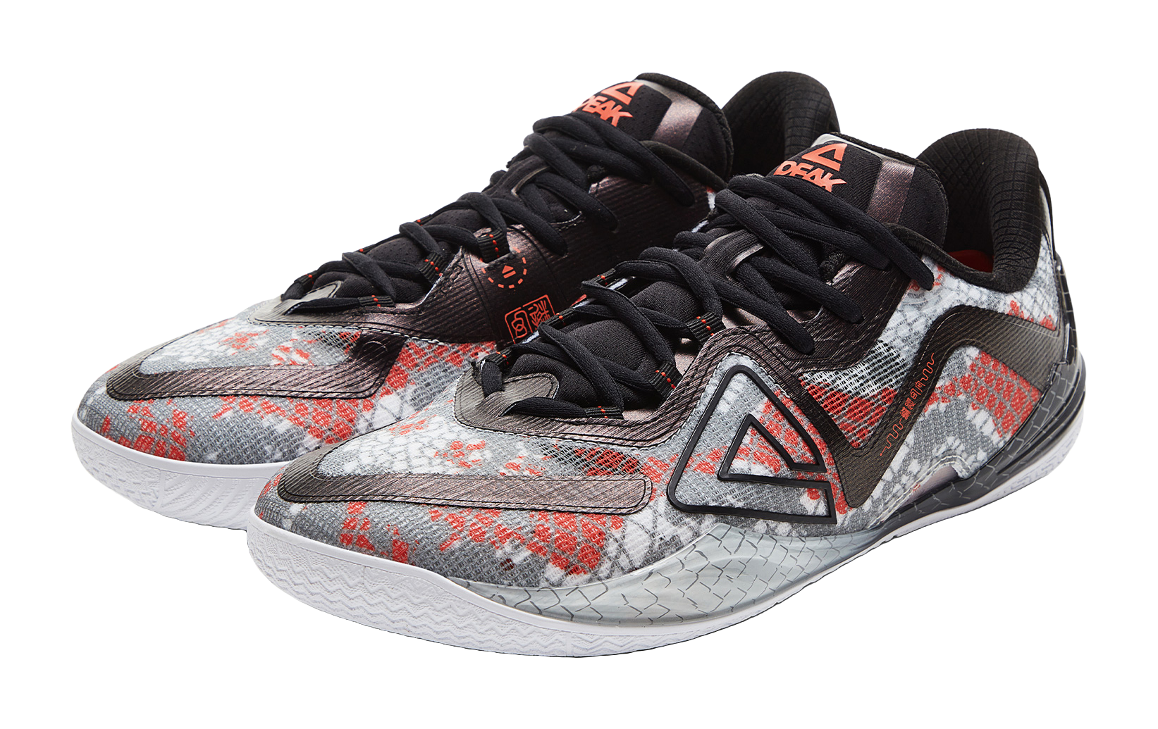 Angled basketball shoe with speckled fabric, black laces, red and gray details
