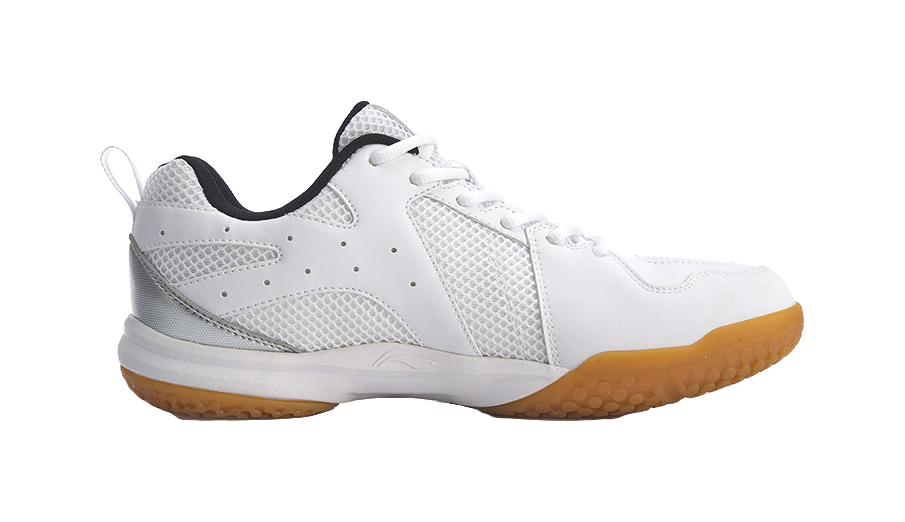Unisex badminton shoe side view, white mesh upper with black collar and orange gum sole