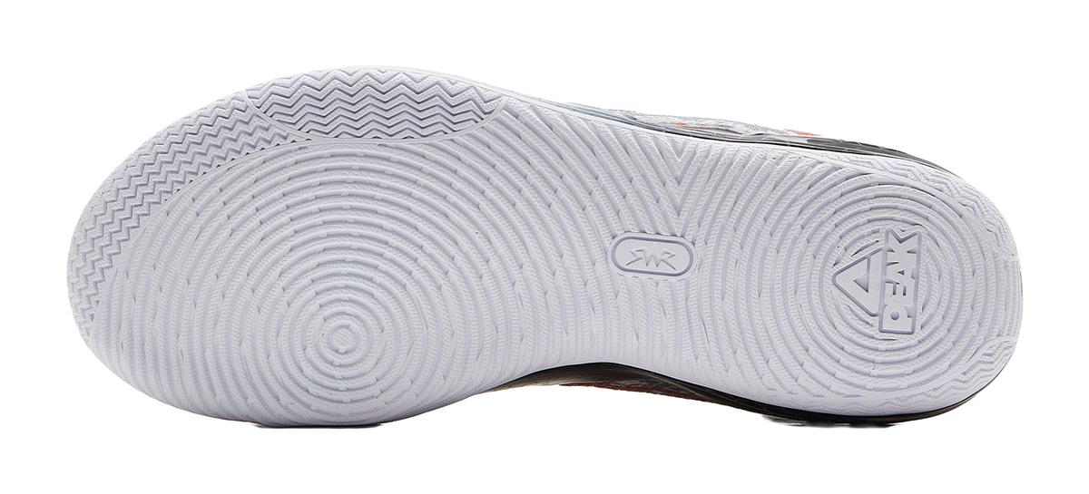Basketball shoe outsole with white tread and herringbone traction pattern