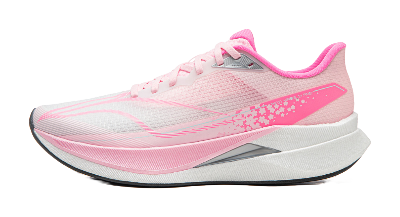 Pink running shoe with white laces, light gray upper, pink side stripe