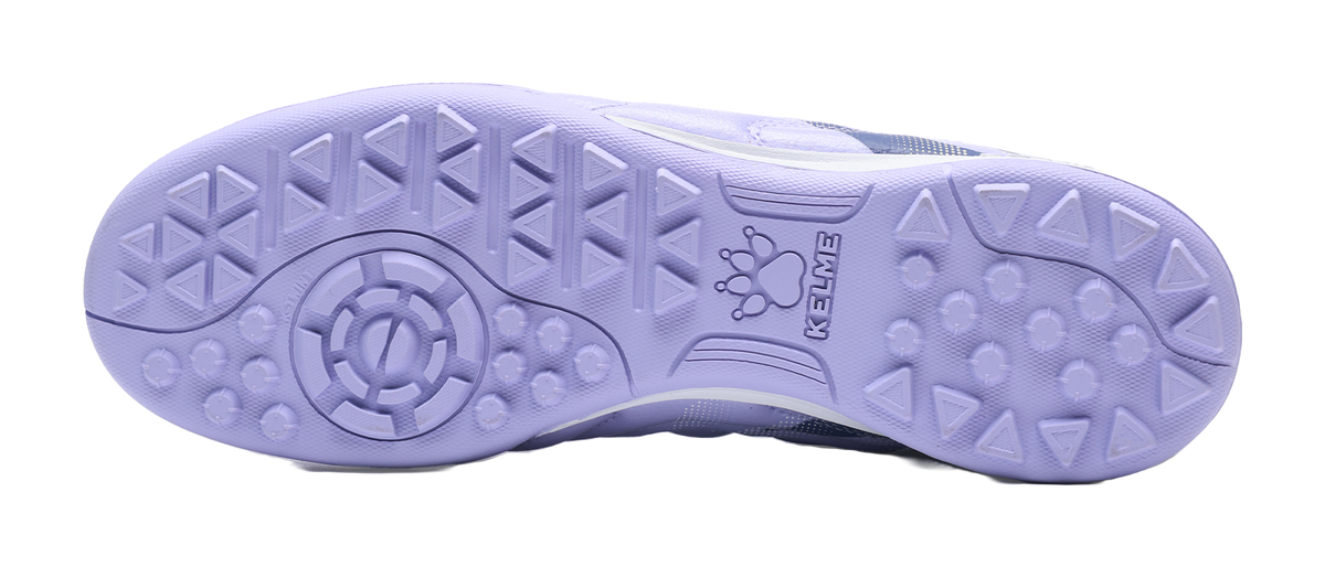 Lilac purple TF turf soccer shoes outsole with round studs and traction tread pattern