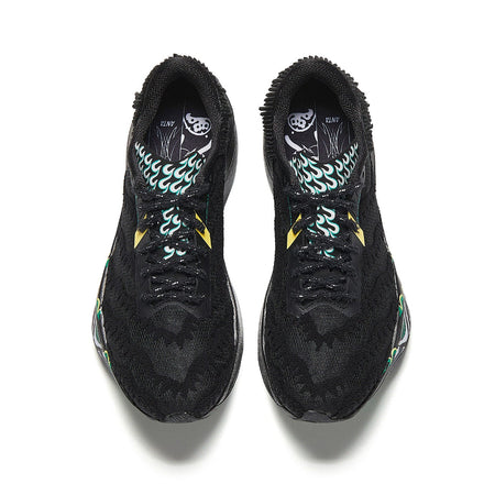 Pair of black running shoes with patterned inner lining and green flame graphics.