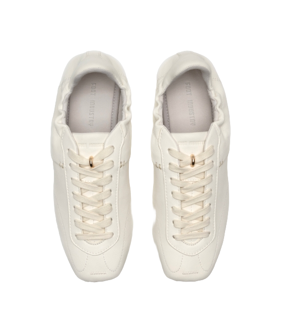 Antique white low-top trainers, front-facing pair with lace hooks and cushioned collar