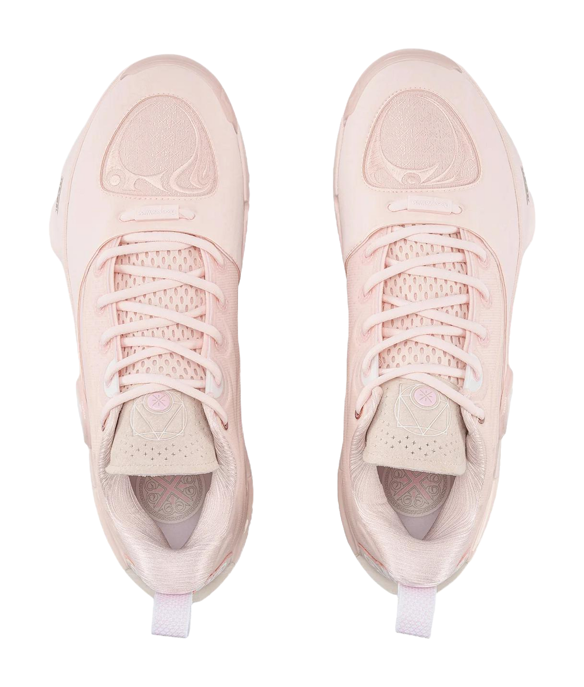 Pair of light pink basketball shoes with lace-up tops and side panel graphics