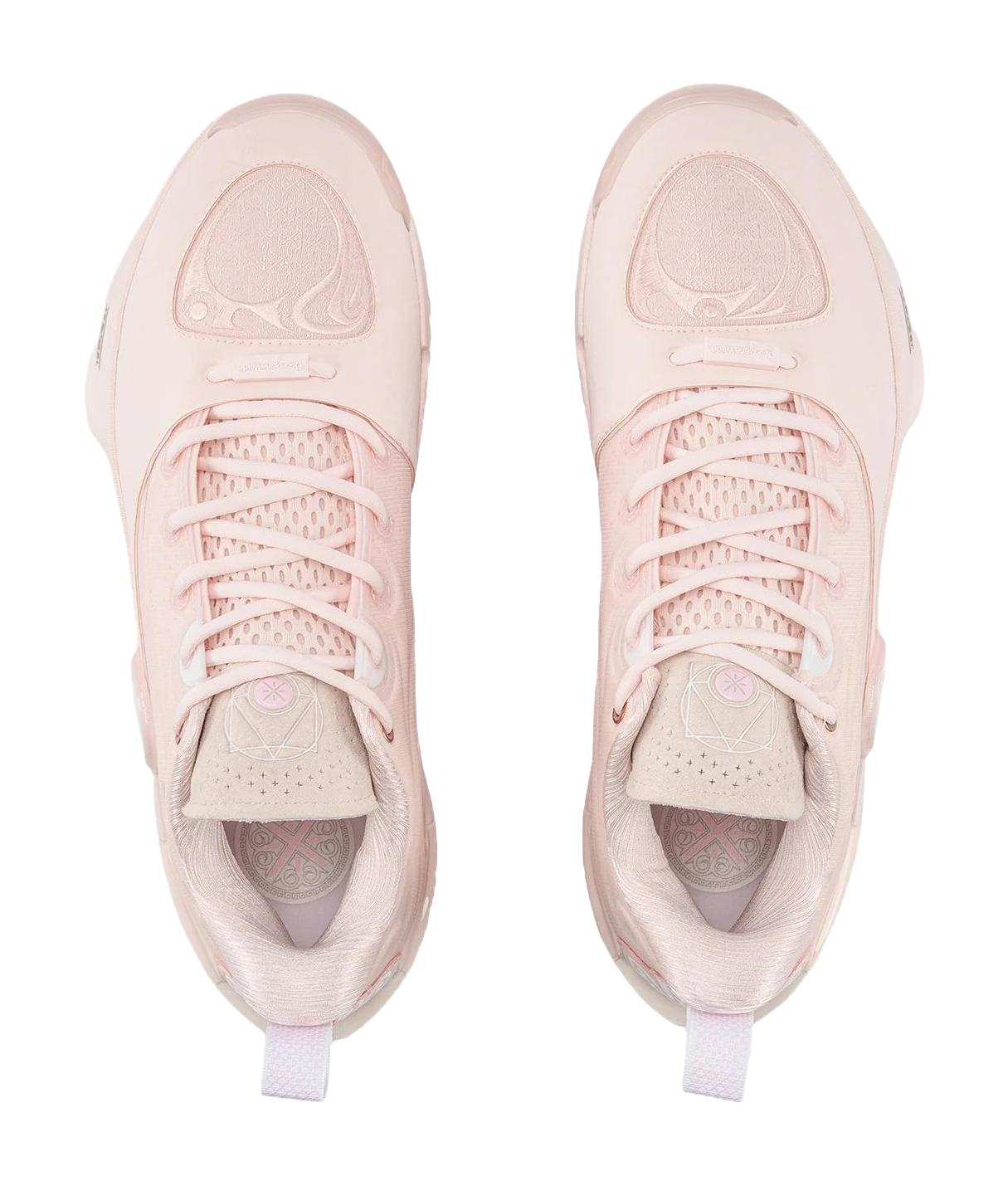Pair of light pink basketball shoes with lace-up tops and side panel graphics