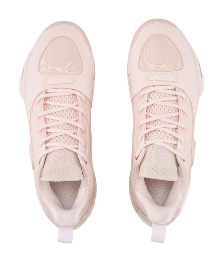 Pair of light pink basketball shoes with lace-up tops and side panel graphics