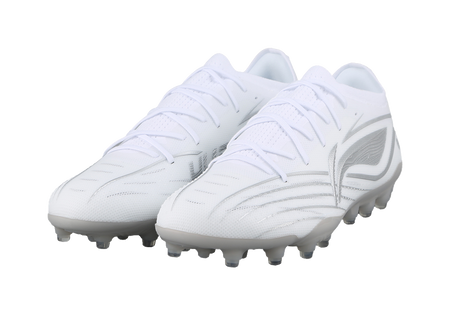 White silvery soccer cleat pair, angled front view, studs visible.