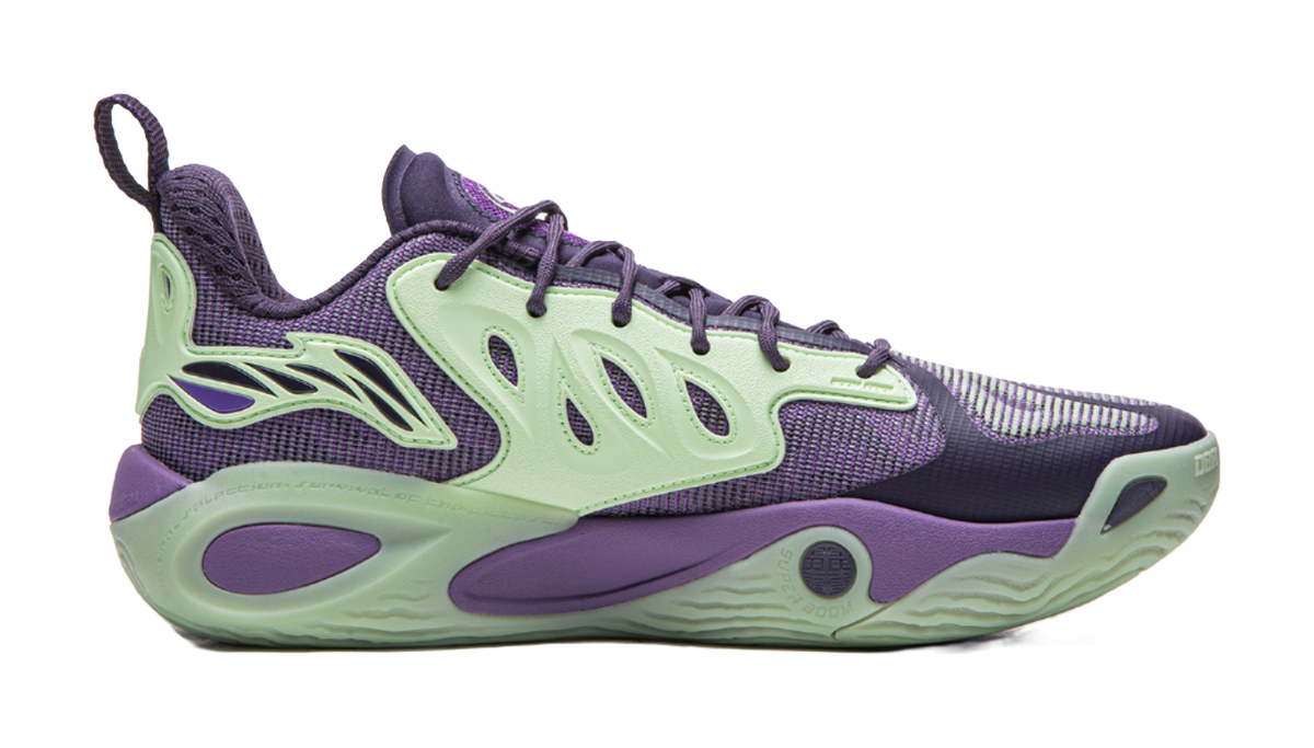 Purple and green basketball shoe side view with mint sole and patterned upper