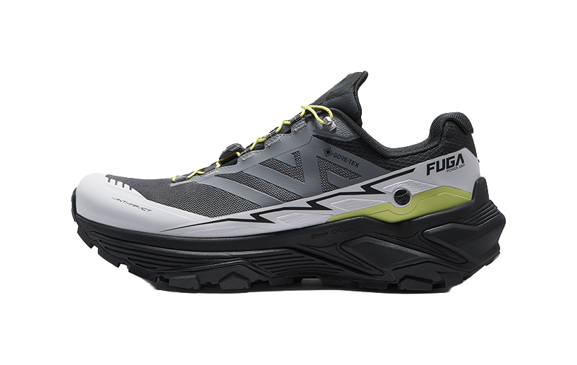 White and black trail running shoe with green accent panel, lace-up closure, side view.