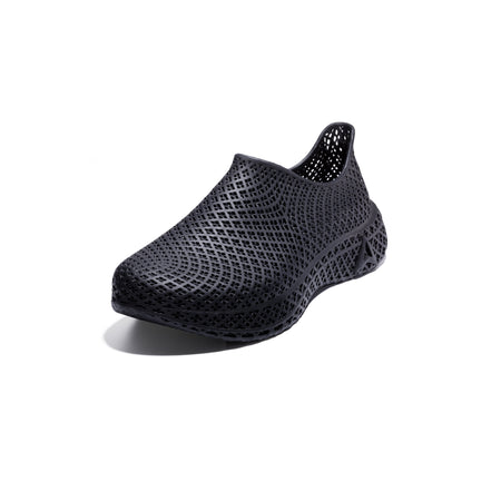3D printed slip-on sneaker, dark textured upper, side view