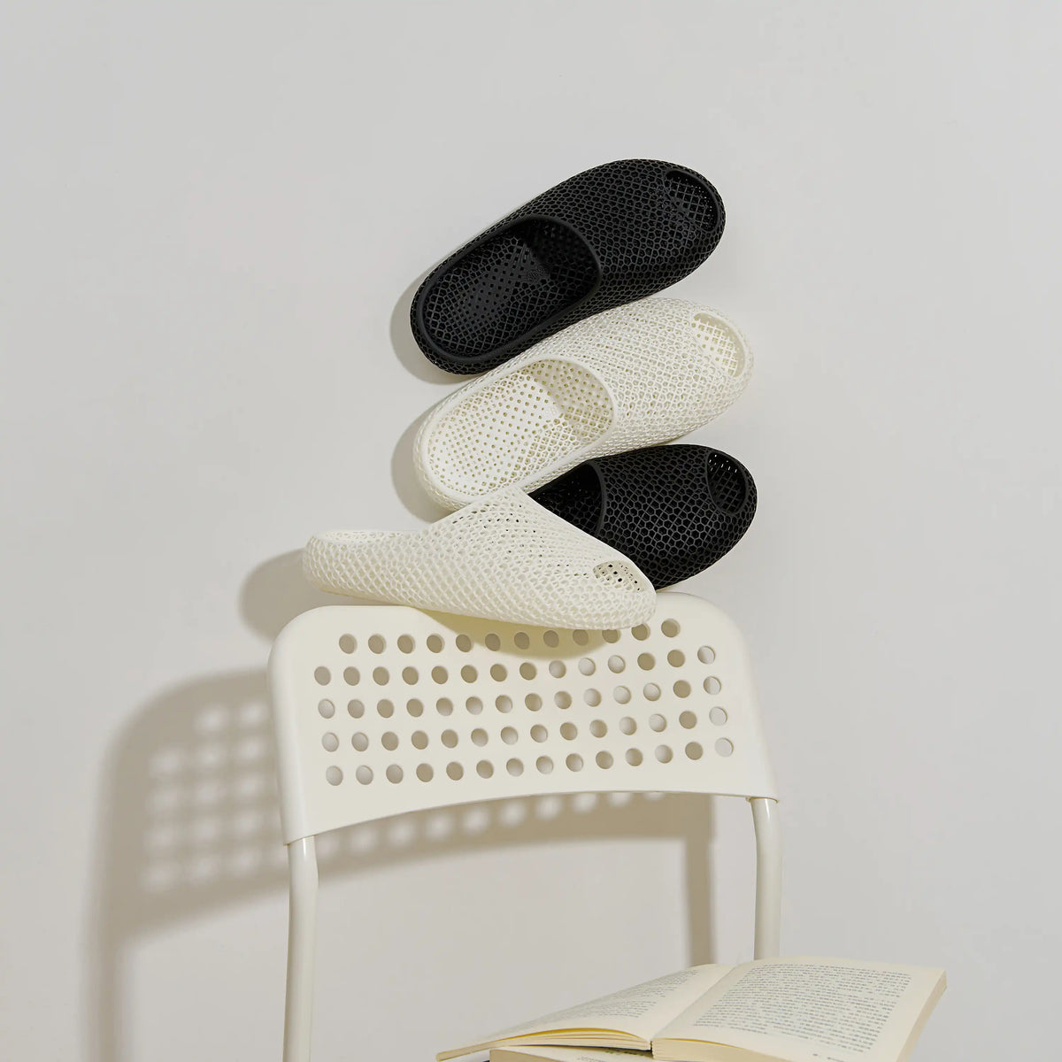 3D printed slippers, white and black open-toe slides with textured footbeds