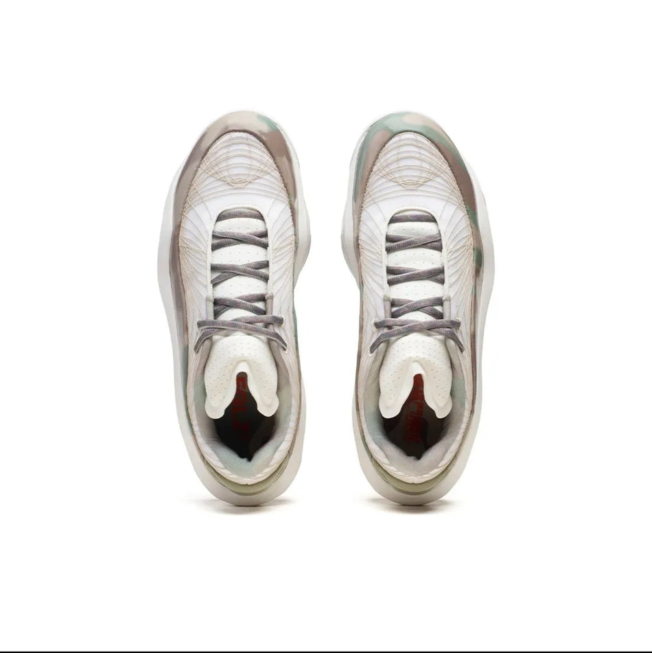 A pair of low-top sneakers shown from a top-down view on a white background, with a black phone app interface framing the photo.