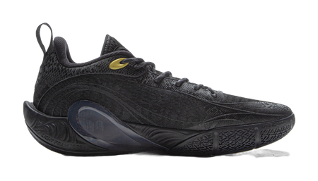 Black low-top basketball shoe with textured upper and gold logo accents