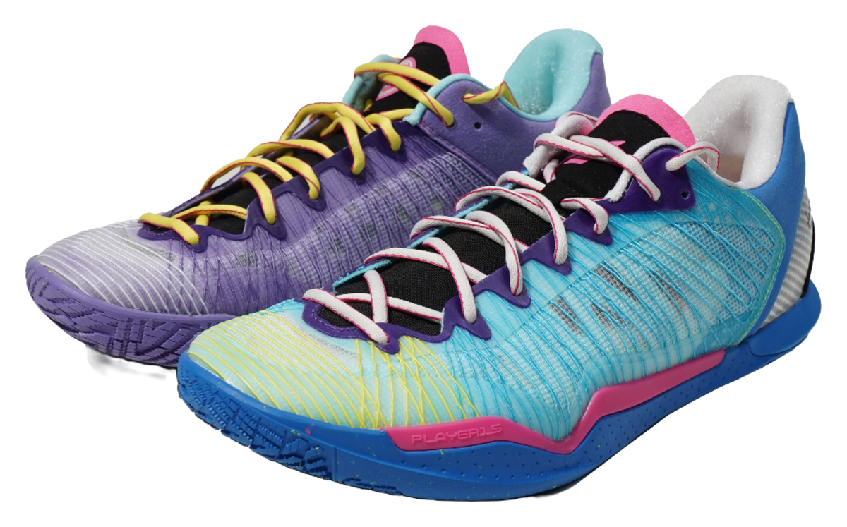 Low-top basketball shoes, purple and teal blue with pink accents, lace-up.