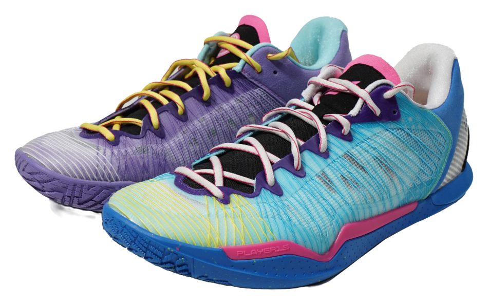 Low-top basketball shoes, purple and teal blue with pink accents, lace-up.