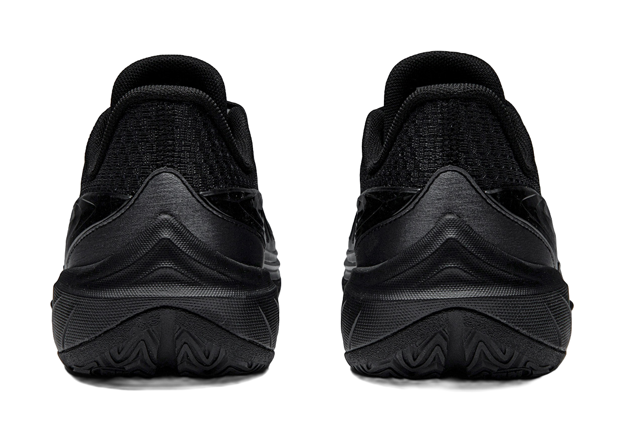 Black low-top basketball shoes heel view with padded collar and treaded sole