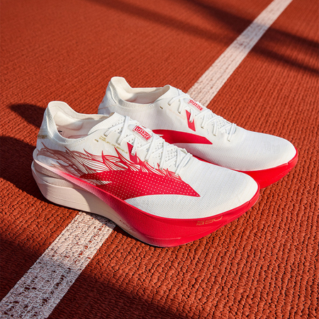 Pair of white and red racing running shoes with horse print, lace-up