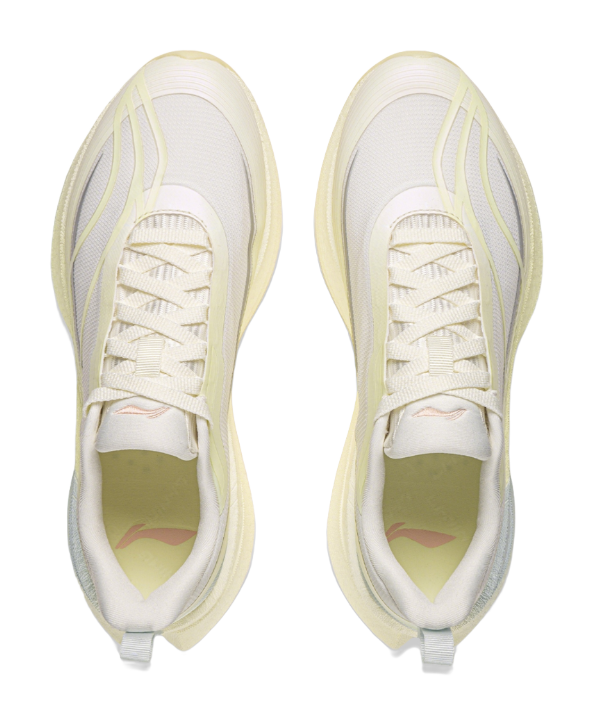 Pair of women's low-top running shoes with off-white laces and mesh uppers
