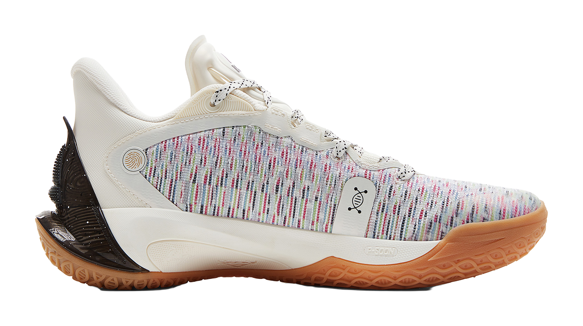 White basketball shoe with multicolor knit side, black heel, gum outsole