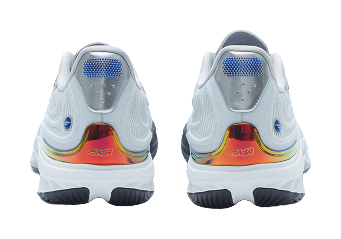 Silver basketball shoe pair, heel view with rainbow accent and cushioned collar