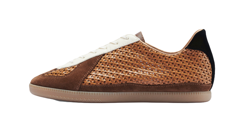 Brown perforated low-top training shoes with white laces and black heel collar