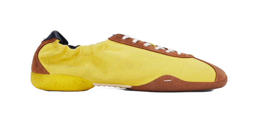 Unisex low-top casual shoes, yellow upper with brown side panels and white sole.