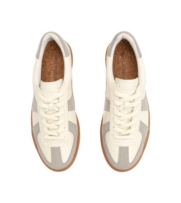 Lace-up low-top shoes with off-white uppers and gray accents; cushioned tongue visible