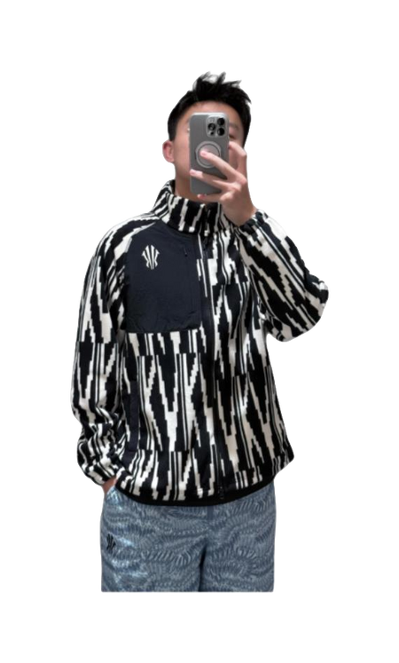 Front view of unisex zip-up sweatshirt jacket with black-and-white all-over pattern and chest logo.