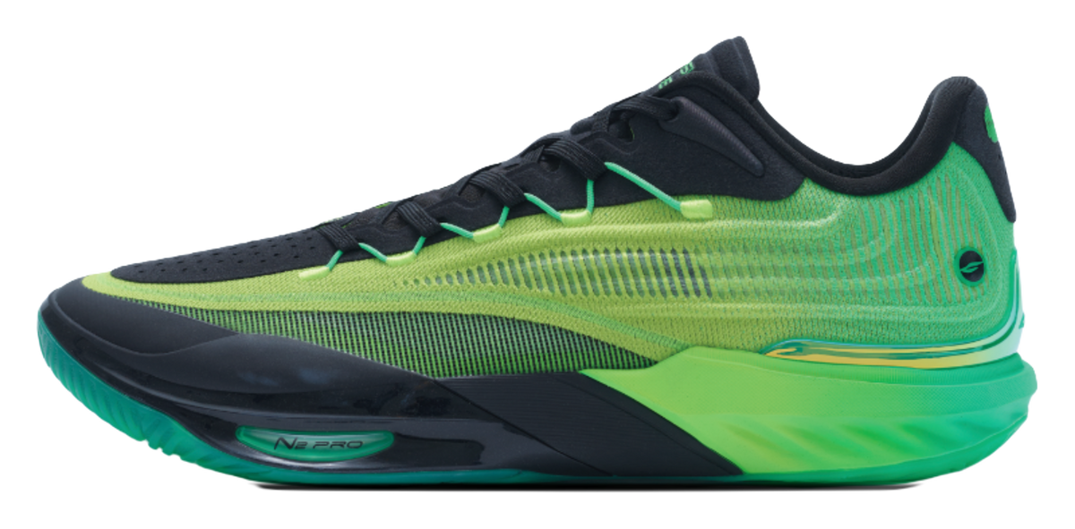 Green and black low-top basketball shoe with green laces and side N-PRO logo