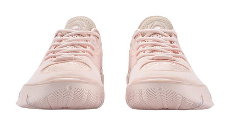 Two light pink basketball shoes viewed from heel, showing outsole tread