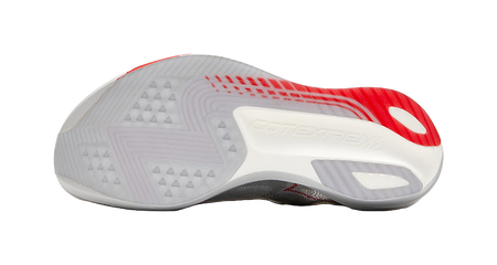 Outsole view of gray running shoe, red traction accents and textured tread