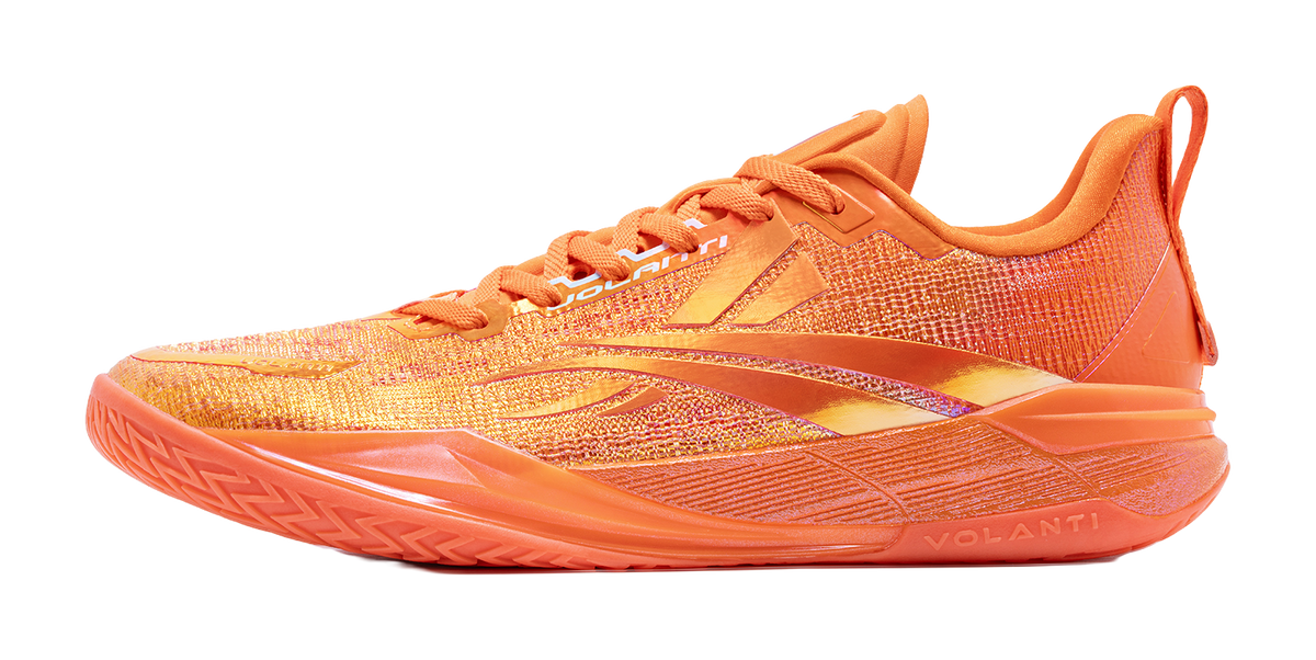 Low top basketball shoes in orange with subtle speckled pattern, lace-up style.