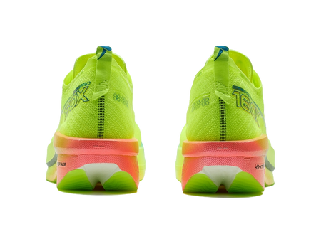 Neon green low-top running shoes, rear view with orange-red outsole and heel tab