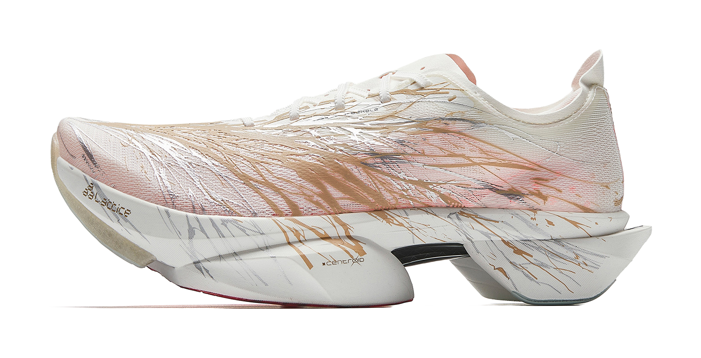 Marathon racing shoes in white with bronze-gold upper and patterned side, angled view