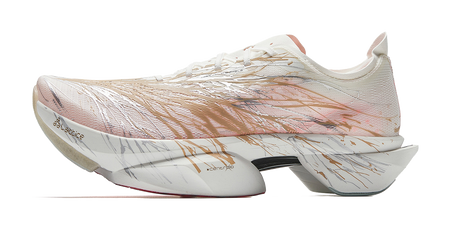 Marathon racing shoes in white with bronze-gold upper and patterned side, angled view