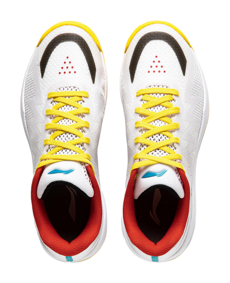 Pair of white table tennis shoes with yellow laces, red inner lining, teal accent