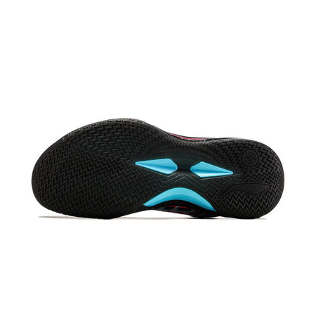 Basketball shoe outsole with black traction tread and teal geometric heel details