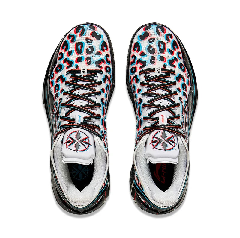 Basketball shoes pair with white laces, blue-pink animal print tongues, and white toe boxes
