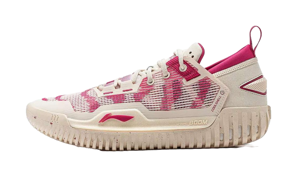 Unisex low-top basketball shoe in beige/cream with pink accents and lace-up closure.