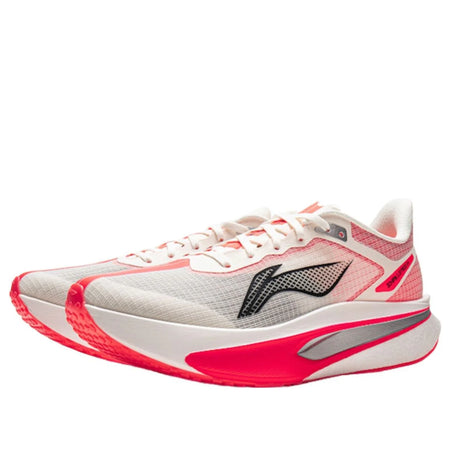 Lace-up running shoe with white mesh upper, red overlays, and black side logo