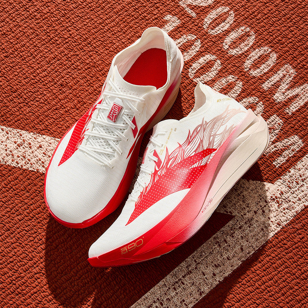 White lace-up running shoes with red horse graphic and red interior lining