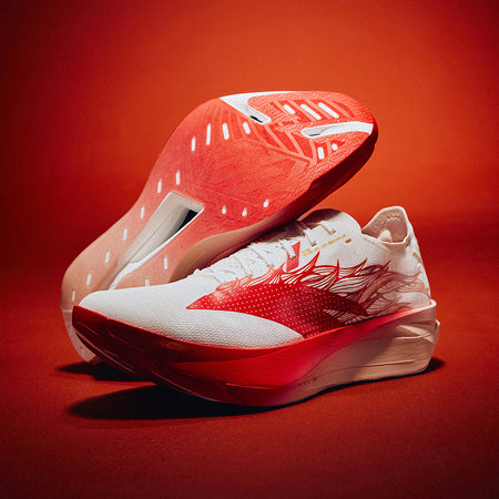 White and red running shoe with visible outsole tread and horse side print