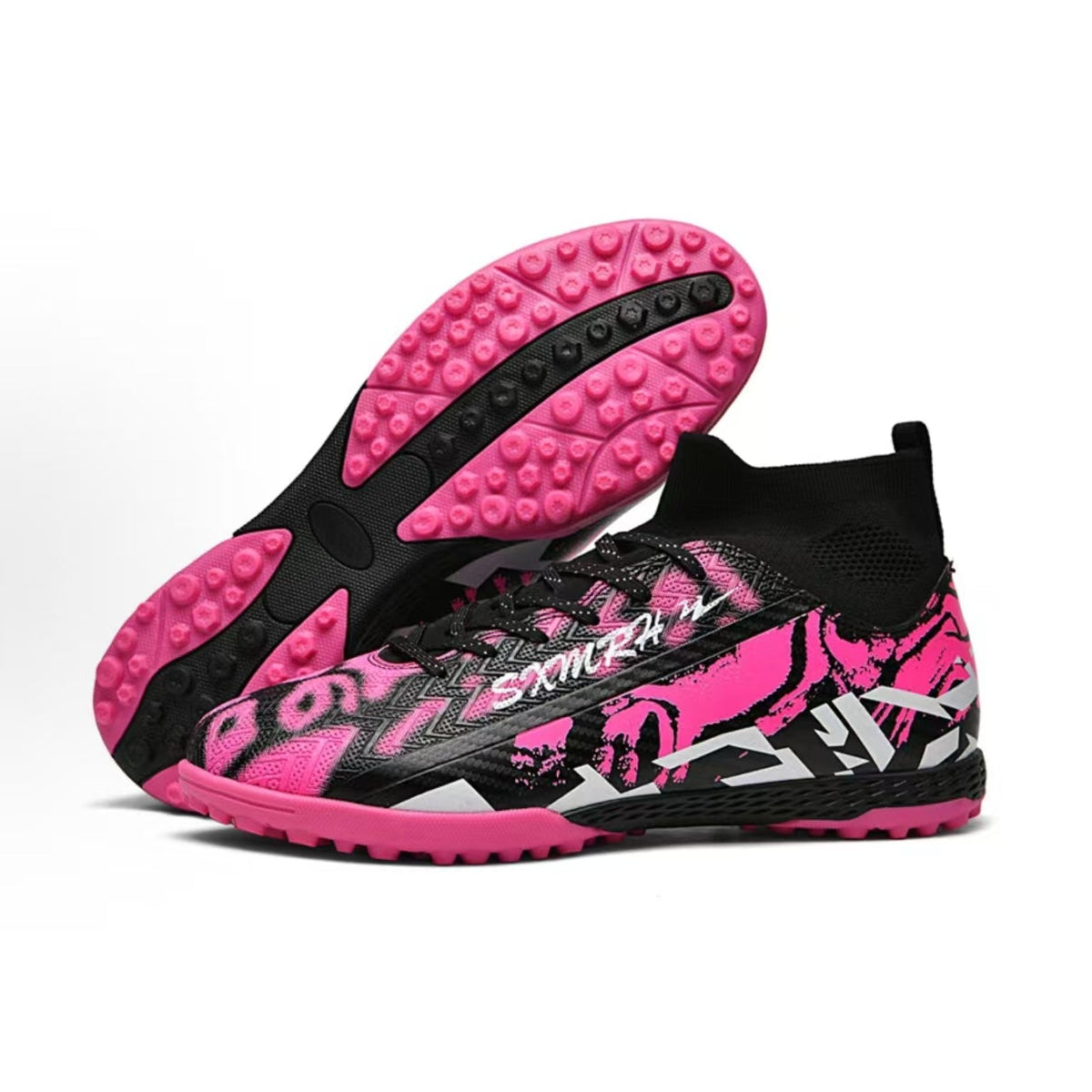 Soccer shoe outsole showing pink tread, black midsection, and round turf studs