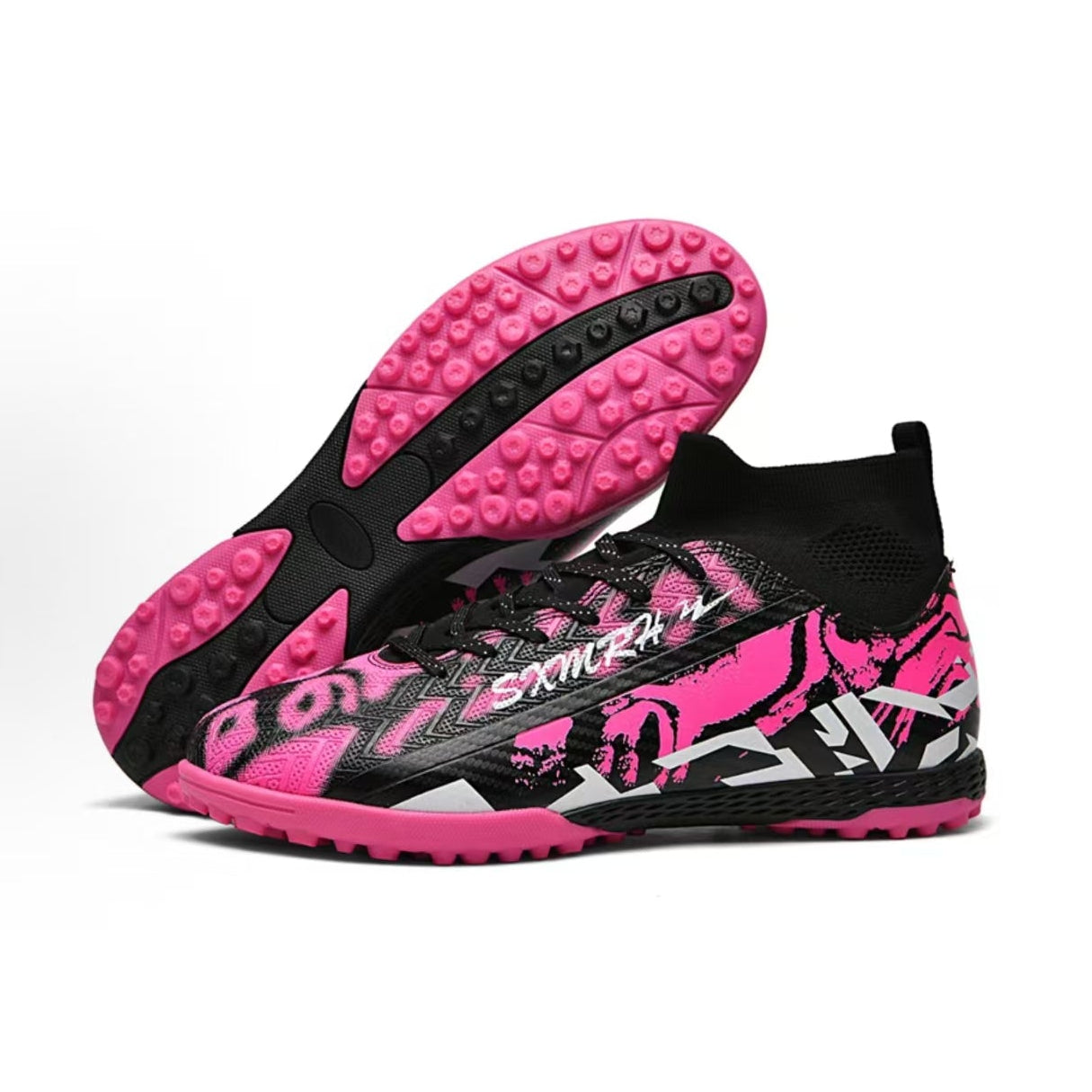 Soccer shoe outsole showing pink tread, black midsection, and round turf studs
