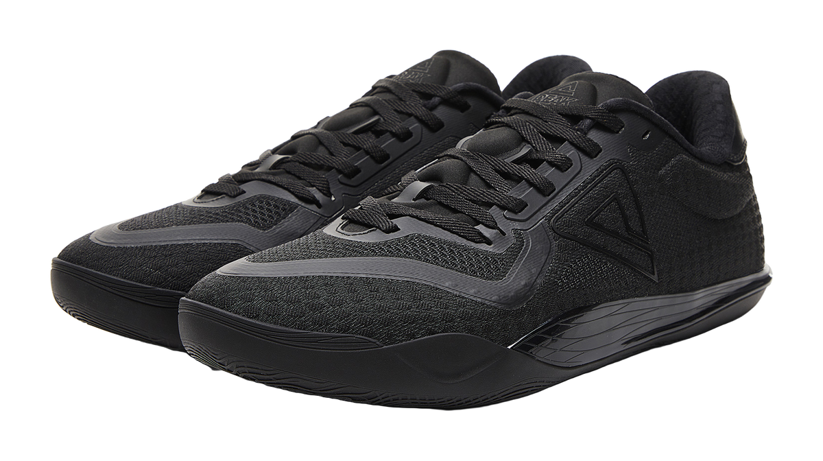 Black lace-up basketball shoe with padded collar and textured toe guard
